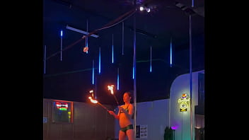Destiny mae dancing and playing with fire on stage at the strip club