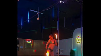 Destiny mae dancing and playing with fire on stage at the strip club