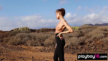 Petite all natural russian beauty poses naked on the rocks