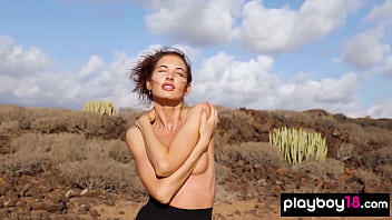 Petite all natural russian beauty poses naked on the rocks