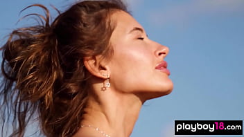 Petite all natural russian beauty poses naked on the rocks