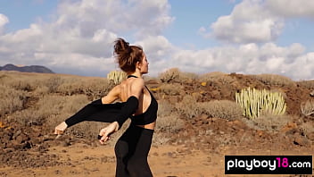 Petite all natural russian beauty poses naked on the rocks