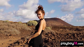 Petite all natural russian beauty poses naked on the rocks