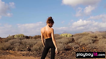 Petite all natural russian beauty poses naked on the rocks