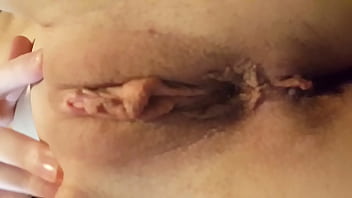 Thin young girlfriend shows her shaved pussy