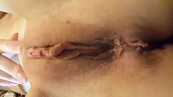 Thin young girlfriend shows her shaved pussy