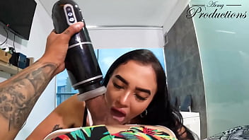 The cleaning girl helps him with his new toy by sucking him