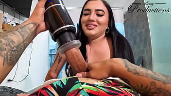 The cleaning girl helps him with his new toy by sucking him