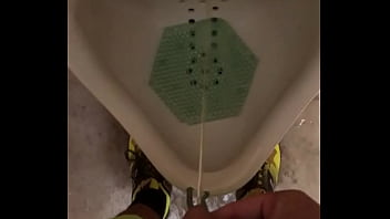 Male Pisses In A Urinal And Thumbs Dick thumbnail