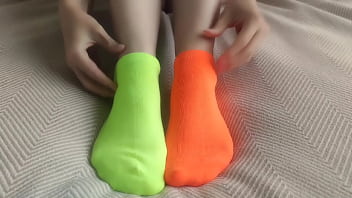 My feet are in colorful mismatched socks for pleasure hot sockjob