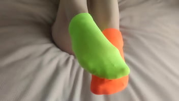 My feet are in colorful mismatched socks for pleasure hot sockjob