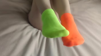 My feet are in colorful mismatched socks for pleasure hot sockjob