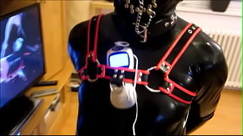 Helpless Rubber Slave In The Floor Pillory thumbnail