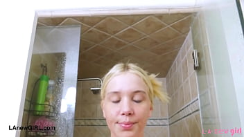 Cute blonde enjoys a sensual bath