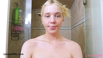 Cute blonde enjoys a sensual bath
