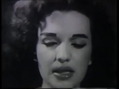 Play MP4 - A mature lady with dark silky hair takes part in the filming of a 60s porn film