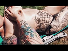 Play MP4 - Tattooed horny brunette with big boobs sunbathing in the yard and rubbing sunscreen on her tits